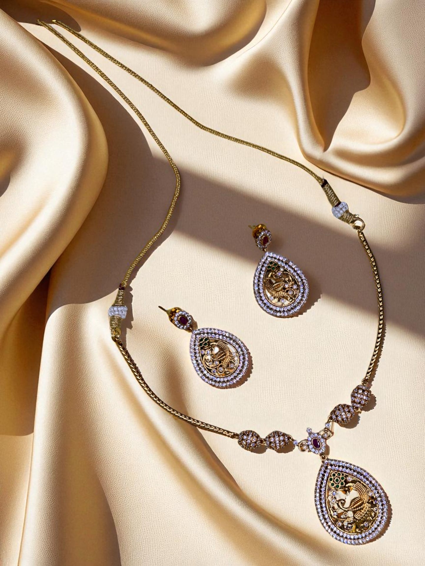 Regal Peacock Motif Gold & Stone-Studded Jewellery Set
